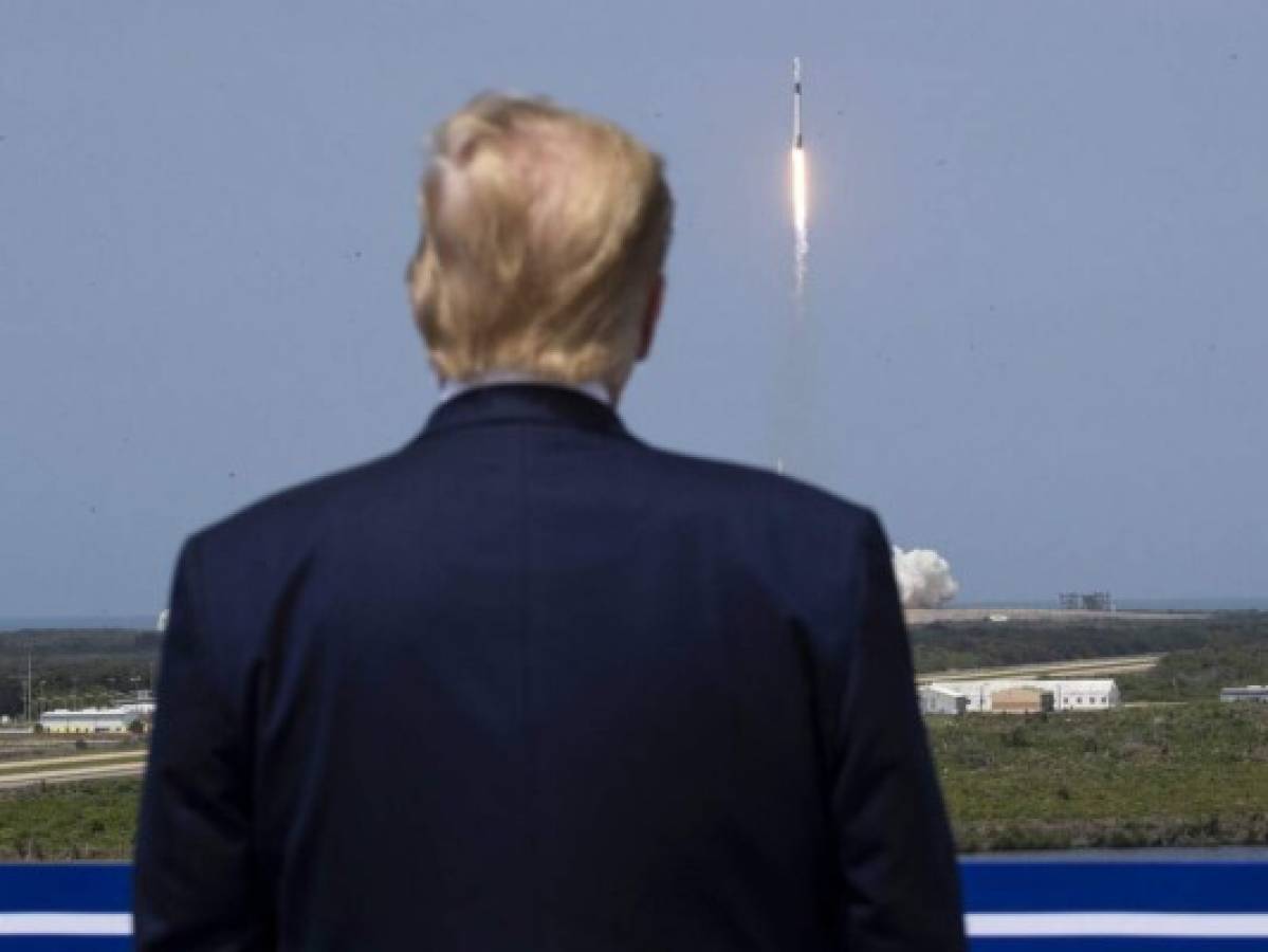 President Donald Trump views the SpaceX flight to the International Space Station, at Kennedy Space Center, Saturday, May 30, 2020, in Cape Canaveral, Fla. (AP Photo/Alex Brandon)