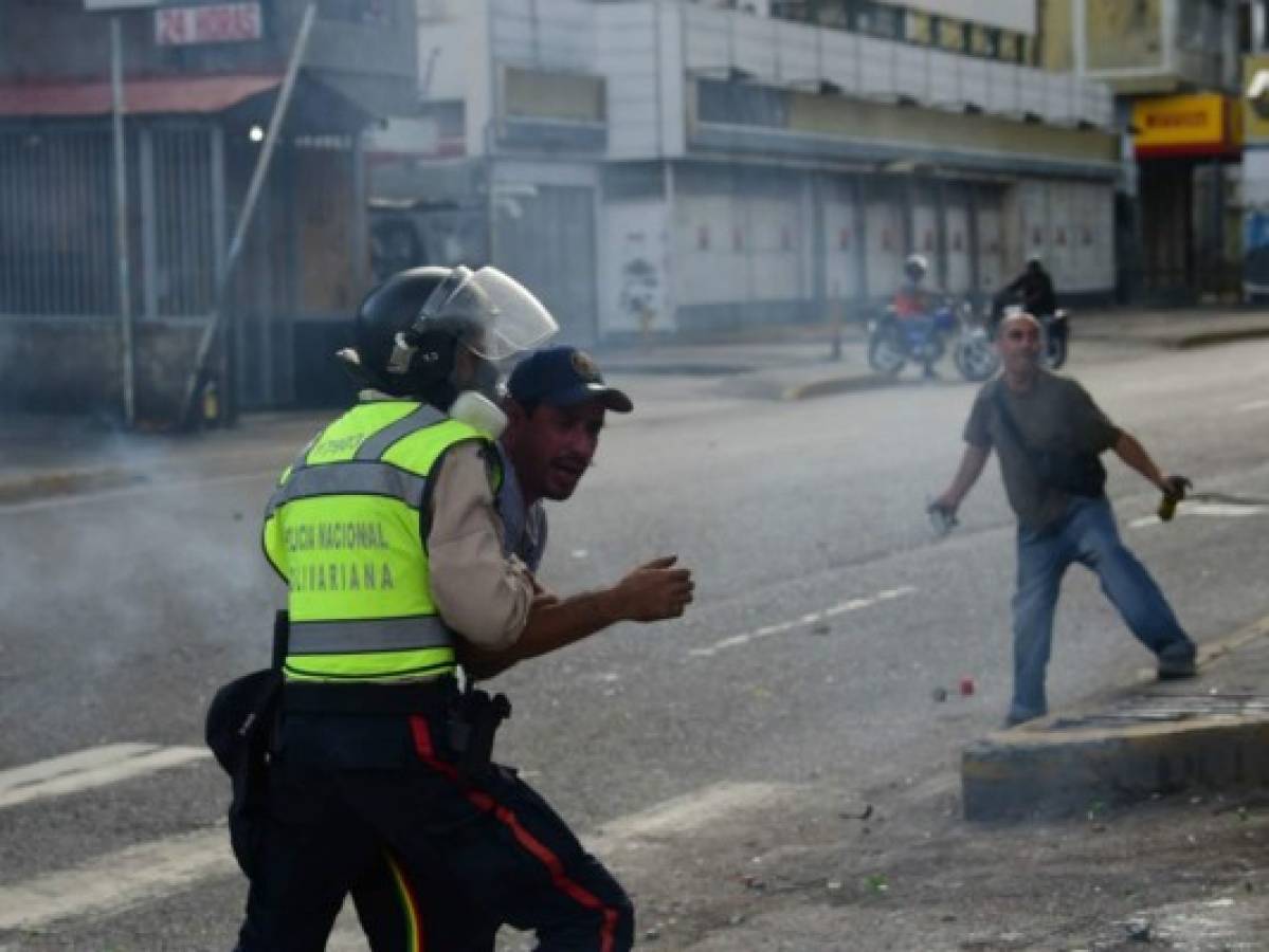Venezuela: Ascienden a 21 los muertos por protestas y saqueos