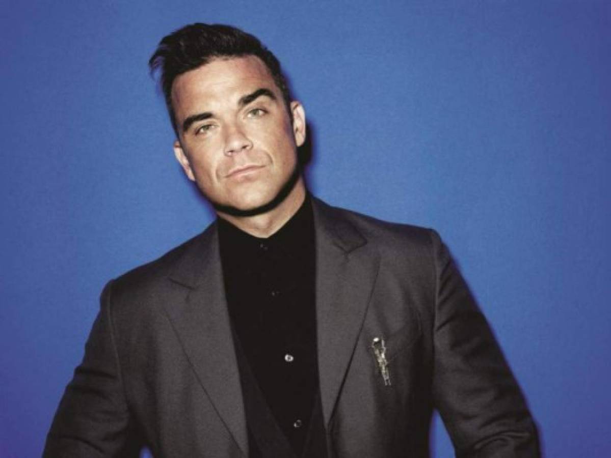 Robbie Williams respondió con ironía a críticas por lavarse las manos tras tocar a seguidores