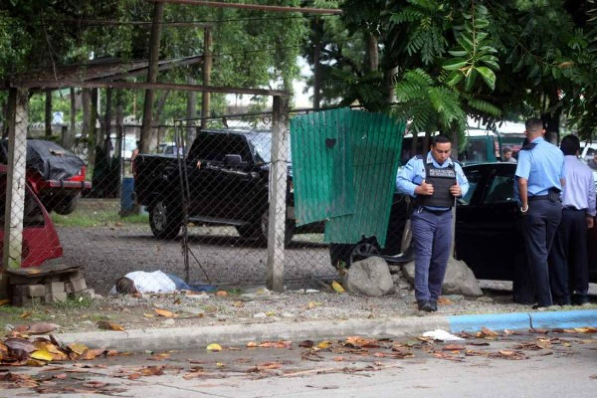 Indagan extorsiones como móvil de masacre en autolote de San Pedro Sula