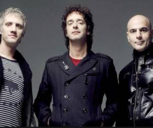 Handout photo released by TELAM on October 3, 2019, showing Argentine rock group Soda Stereo during a press conference in Buenos Aires on September 9, 2007. - Former Soda Stereo members Charly Alberti and Zeta Bosio announced on September 3, 2019, that they will tour Latin American stages with guest singers to pay tribute to the late leader of the band, Gustavo Cerati. (Photo by MAXIMILIANO LUNA / TELAM / AFP) / Argentina OUT / RESTRICTED TO EDITORIAL USE - MANDATORY CREDIT AFP PHOTO / TELAM / Maximiliano LUNA - NO MARKETING - NO ADVERTISING CAMPAIGNS - DISTRIBUTED AS A SERVICE TO CLIENTS