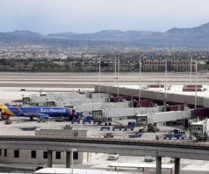 LAS VEGAS, NEVADA - MARCH 19: A single Southwest Airlines jet is shown parked at a gate at McCarran International Airport as the coronavirus continues to spread across the United States on March 19, 2020 in Las Vegas, Nevada. On Tuesday, Nevada Gov. Steve Sisolak announced a statewide closure of all nonessential businesses, including all hotel-casinos on the Las Vegas Strip, for at least 30 days to help combat the spread of the virus. The World Health Organization declared the coronavirus (COVID-19) a global pandemic on March 11th. Ethan Miller/Getty Images/AFP== FOR NEWSPAPERS, INTERNET, TELCOS & TELEVISION USE ONLY ==