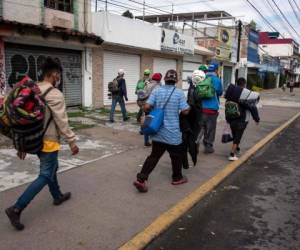 En los últimos días los organizadores de la caravana han solicitado autobuses luego de pasar tres semanas en las carreteras, caminando y aceptando viajes de dedo. Foto: AFP