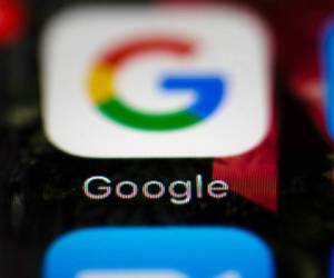 FILE- This April 26, 2017, file photo shows a Google icon on a mobile phone in Philadelphia. Google is spearheading an educational campaign to teach pre-teen children how to protect themselves from scams, predators and other trouble. The program announced Tuesday, June 6, is called “Be Internet Aware.” (AP Photo/Matt Rourke, File)