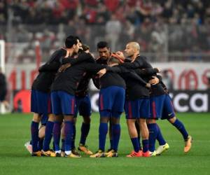 Los jugadores del FC Barcelona previo al duelo de Champions League ante el Olympiakos. (AFP)