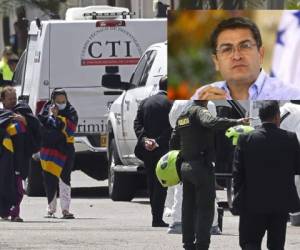 La policía atiende a las víctimas en los alrededores la Escuela de Oficiales General Francisco de Paula Santander en Bogotá tras el ataque. (Foto: AFP)