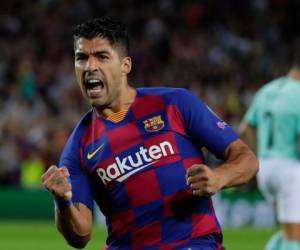 Luis Suárez se convirtió en el héroe del partido al anotar dos goles. (AFP)