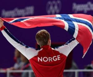 Noruega ganó este lunes la medalla de oro de patinaje de velocidad 500 metros con Haavard Lorentzen. Foto AFP