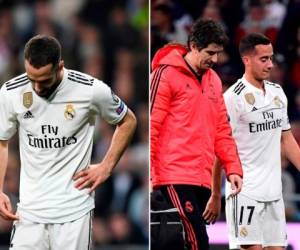 Los jugadores del Real Madrid Dani Carvajal y Lucas Vázquez al momento de salir lesionados del campo. (AFP)