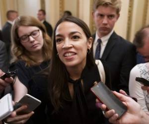 (FILES) In this file photo Rep. Alexandria Ocasio-Cortez(D-NY) listens as Facebook Chairman and CEO Mark Zuckerberg testifies before the House Financial Services Committee on 'An Examination of Facebook and Its Impact on the Financial Services and Housing Sectors' in the Rayburn House Office Building in Washington, DC on October 23, 2019. - Progressive rising star Democrat Alexandria Ocasio-Cortez was named May 13, 2020 as a co-chair of a new task force aimed at unifying the party's more liberal wing with moderates in support of White House hopeful Joe Biden. 'A united party is key to defeating Donald Trump this November and moving our country forward through an unprecedented crisis,' Biden said. (Photo by MANDEL NGAN / AFP)