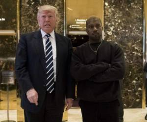 President-elect Donald Trump and Kanye West pose for a picture in the lobby of Trump Tower in New York, Tuesday, Dec. 13, 2016. (AP Photo/Seth Wenig)