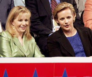 (FILES)Elizabeth (L) and Mary Cheney, daughters of Vice President Dick Cheney attend the Republican National Convention at Madison Square Garden in New York City in this September 1,2004 file photo. The daughters of former vice president Cheney are quarreling publicly over comments Liz Cheney, running for office in Wyoming, made opposing Mary Cheney's right to marry her wife. In an interview on FoxNews , November 17, 2013, Liz Cheney said she does 'believe in the traditional definition of marriage,' meaning it should be limited to unions between a man and a woman. She said she loves her sister and her sister's family 'very much,' but 'this is just an issue on which we disagree.' The remarks triggered an angry response from sister-in-law Heather Poe, who shot back on Facebook. 'Liz has been a guest in our home, has spent time and shared holidays with our children, and when Mary and I got married in 2012 -- she didn't hesitate to tell us how happy she was for us. AFP PHOTO/JEFF HAYNES