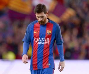Barcelona's Argentinian forward Lionel Messi walks on the pitch at the end of the UEFA Champions League quarter-final second leg football match FC Barcelona vs Juventus at the Camp Nou stadium in Barcelona on April 19, 2017.The game ended with a draw and Juventus is qualified for the semis. / AFP PHOTO / Josep LAGO