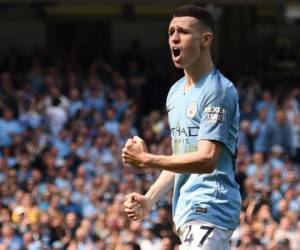 El mediocampista inglés del Manchester City Phil Foden celebra el gol de apertura durante el partido de fútbol de la Premier League inglesa entre el Manchester City y el Tottenham Hotspur en el Etihad Stadium en Manchester, noroeste de Inglaterra. foto: AFP