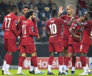 Los jugadores del Liverpool celebrando uno de los goles ante el Genk en Champions League. (AFP)