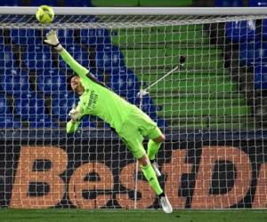 Thibaut Courtois fue la gran figura del partido evitando en varias ocasiones la caída del arco merengue. Foto: AFP