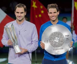 Roger Federer junto a Rafael Nadal. (AFP)