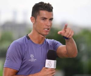 Real Madrid's Portuguese forward Cristiano Ronaldo gestures in the mixed zone at Valdebebas Sport City in Madrid on May 30, 2017 at the Media Day event prior to the UEFA Champions League football match final Juventus vs Real Madrid. / AFP PHOTO / PIERRE-PHILIPPE MARCOU
