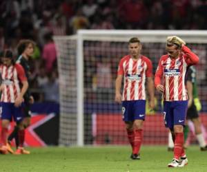El Atlético Madrid sufrió su primera caída de Champions en su nuevo estadio. Los jugadores no lo podían creer. (AFP)