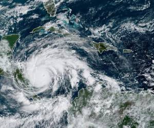 This RAMMB/NOAA satellite image shows Tropical Storm Iota on November 16, 2020, at 14:40 UTC as it approaches Central America. - Less than two weeks after powerful storm Eta killed more than 200 people across Central America, authorities warned that Hurricane Iota has strengthened to a Category 5 storm. (Photo by Handout / RAMMB/NOAA/NESDIS / AFP) / RESTRICTED TO EDITORIAL USE - MANDATORY CREDIT 'AFP PHOTO / RAMMB/NOAA' - NO MARKETING - NO ADVERTISING CAMPAIGNS - DISTRIBUTED AS A SERVICE TO CLIENTS