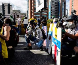 'Les dan drogas (a los menores en las protestas), les dan dinero', aseveró Maduro. (Foto: AFP/El Heraldo Honduras/ Noticias de Honduras)