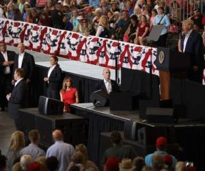 MELBOURNE, FL - FEBRUARY 18: Melania Trump listens as her husband President Donald Trump speaks during a campaign rally at the AeroMod International hangar at Orlando Melbourne International Airport on February 18, 2017 in Melbourne, Florida. President Trump is holding his rally as he continues to try to push his agenda through in Washington, DC. Joe Raedle/Getty Images/AFP== FOR NEWSPAPERS, INTERNET, TELCOS & TELEVISION USE ONLY ==