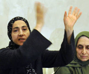 Zubeidat Tsarnaeva (l), mother of the suspected Boston bombers, brothers Tamerlan and Dzhokhar Tsarnayev, and their aunt Patimat Suleymanova attend a news conference in Makhachkala on April 25, 2013. The mother of the two brothers suspected of carrying out the Boston bombings on Thursday launched an impassioned attack on the US authorities over the death of one of her sons, as her husband planned to return to the United States find out what happened. The parents of the two suspects Tamerlan and Dzhokhar Tsarnaev, spoke to reporters at a news conference in the Russian region of Dagestan where they were living when the Boston marathon bombings took place. AFP PHOTO / NEWS TEAM / SERGEI RASULOV