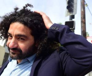 Iraqi filmmaker Mohamed Al-Dharadji whose film 'The Journey', is Iraq's entry for the Oscar's Foreign Film entries, poses for a photo on the streets of West Hollywood, California on November 27, 2018. - The Iraq War may have ended in 2011 but for filmmaker Mohamed al-Daradji, the conflict that tore his country apart is still very much part of his everyday life. The film -- set in 2006, five minutes before Iraqi dictator Saddam Hussein died at dawn by hanging -- is about a female suicide bomber planning an attack during the reopening of the Baghdad train station. (Photo by Frederic J. BROWN / AFP)