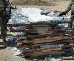 La droga estaba escondida dentro de 92 paneles y placas de concreto en cuatro contenedores que estaban en las instalaciones de la Sociedad Portuaria Regional de Cartagena, indicó el ente en un comunicado.