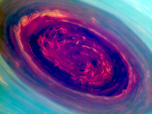 In an undated in this false-color image from NASA's Cassini spacecraft and provided by NASA/JPL shows stunning views of a monster hurricane at Saturn's North Pole. The eye of the cyclone is an enormous 1,250 miles across. That's 20 times larger than the typical eye of a hurricane here on Earth. The hurricane is believed to have been there for years.This image is among the first sunlit views of Saturn's north pole captured by Cassini's imaging cameras. (AP Photo/NASA/JPL-Caltech/SSI)