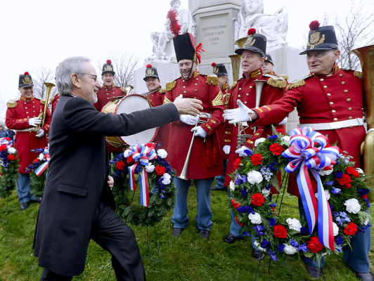 Director Steven Spielberg, left, greets members of 'The President's Own Band,' a musical group of Civil War re-enactors, during a ceremony to mark the 149th anniversary of President Abraham Lincoln's delivery of the Gettysburg Address at Soldier's National Cemetery in Gettysburg, Pa., Monday, Nov. 19, 2012. Spielberg and historian Doris Kearns Goodwin were also on hand to deliver remarks and participate in a wreath-laying ceremony. (AP Photo/Patrick Semansky)