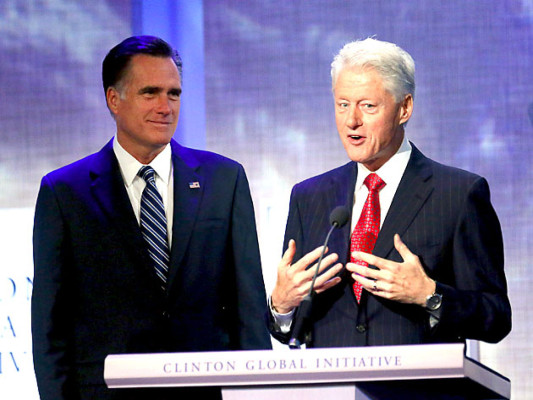 NEW YORK, NY - SEPTEMBER 25: Former U.S. President Bill Clinton (R) speaks as Republican presidential candidate, former Massachusetts Gov. Mitt Romney stands by at the Clinton Global Initiative meeting on September 25, 2012 in New York City. Timed to coincide with the United Nations General Assembly, CGI brings together heads of state, CEOs, philanthropists and others to help find solutions to the world's major problems. Mario Tama/Getty Images/AFP== FOR NEWSPAPERS, INTERNET, TELCOS & TELEVISION USE ONLY ==