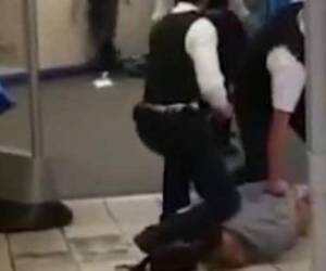 In this grab taken from video made available by @HLOBlog, a man is surrounded by police after an incident on London Bridge, in London, Friday, Nov. 29, 2019. A man wearing a fake explosive vest stabbed several people before being tackled by members of the public and then shot dead by armed officers on London Bridge, police and the city’s mayor say. Police say they are treating it as a terrorist attack. (@HLOBlog via AP)