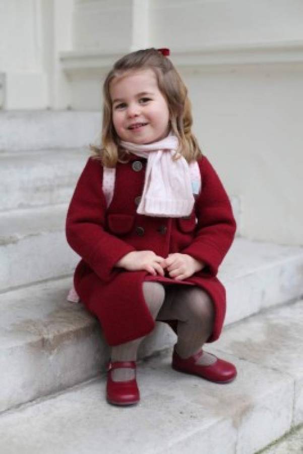 A handout picture released by Kensington Palace on January 8, 2018 shows Britain's Princess Charlotte of Cambridge posing for a photograph at Kensington Palace in central London on January 8, 2018, shortly before leaving for her first day of nursery at the Willcocks Nursery School. / AFP PHOTO / KENSINGTON PALACE / The Duchess of Cambridge / RESTRICTED TO EDITORIAL USE - MANDATORY CREDIT 'AFP PHOTO / KENSINGTON PALACE / DUCHESS OF CAMBRIDGE' - NO MARKETING NO ADVERTISING CAMPAIGNS - RESTRICTED TO SUBSCRIPTION USE - STRICTLY NO SALES - DISTRIBUTED AS A SERVICE TO CLIENTS