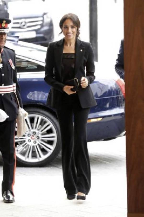 Meghan the Duchess of Sussex arrives with Britain's Prince Harry for the annual WellChild awards at the Royal Lancaster Hotel in London, Tuesday, Sept. 4, 2018. The couple attended the annual WellChild awards Tuesday for the charity, who help to get seriously ill children and young people out of hospital and home to their families. (AP Photo/Matt Dunham)