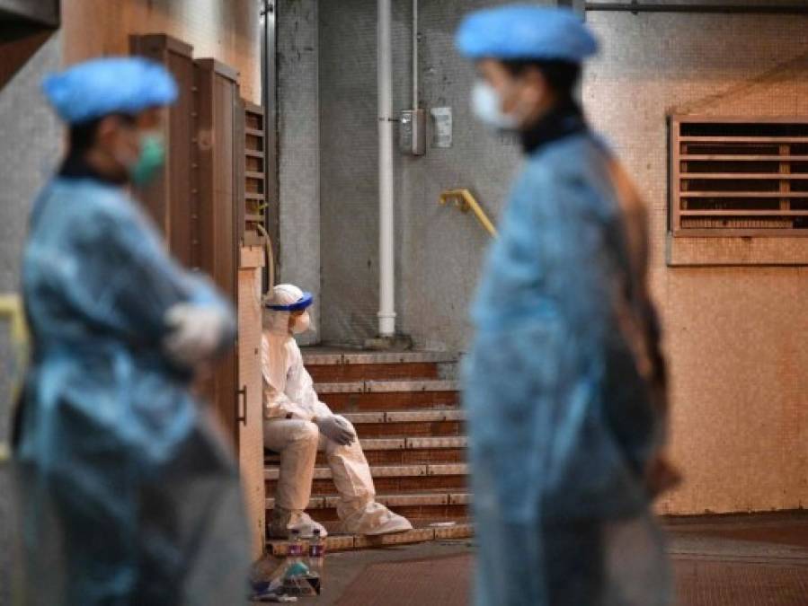 FOTOS: Rigurosa inspección en Hong Kong tras infección en cena familiar