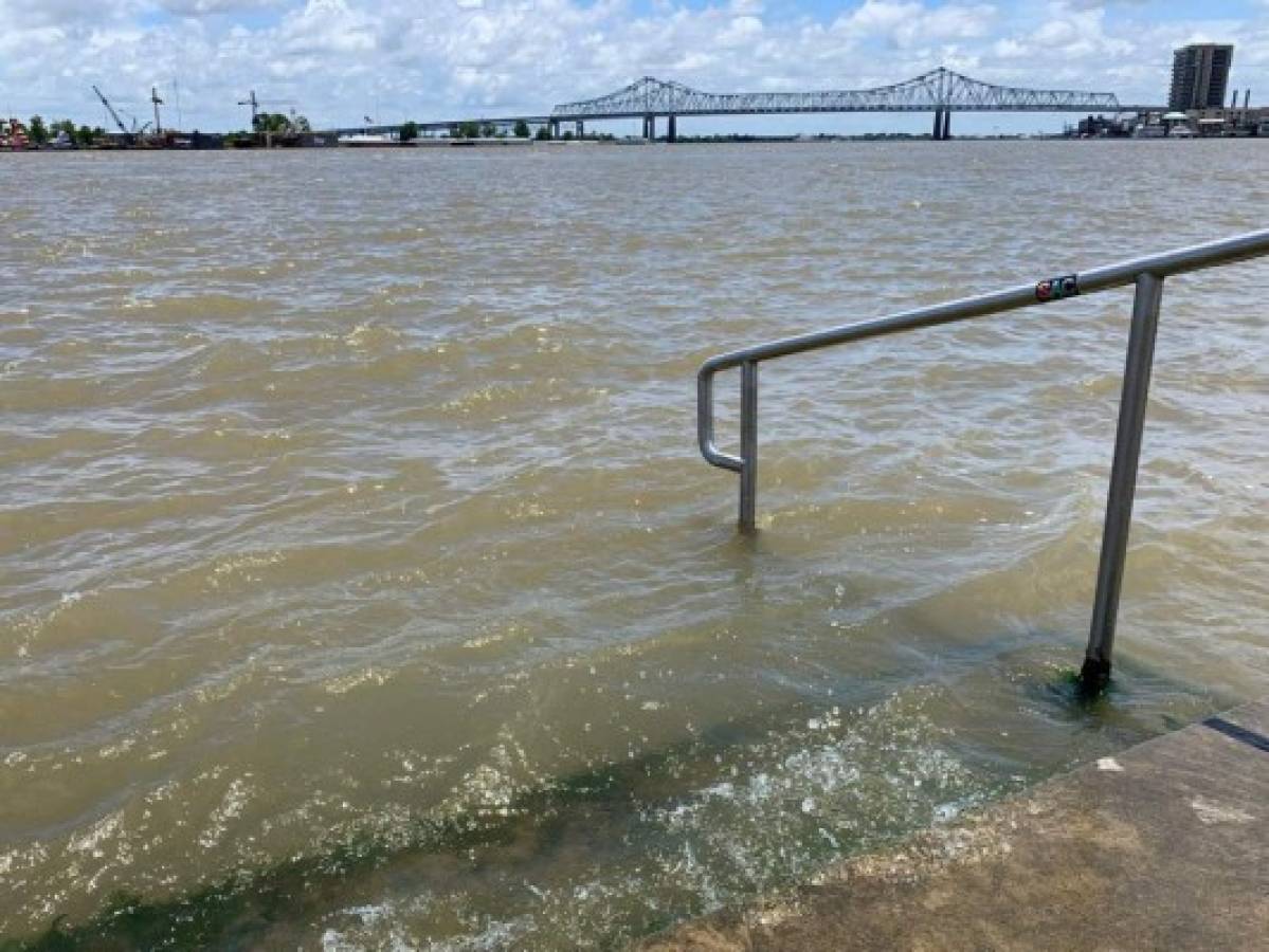 The Mississippi River laps at the stairs on a protective levee in New Orleans as tropical storm Barry approaches on July 11, 2019. - Tropical storm Barry barreled toward rain-soaked New Orleans on July 11 as the city hunkered down for an ordeal that evoked fearful memories of 2005's deadly Hurricane Katrina. (Photo by Michael Mathes / AFP)