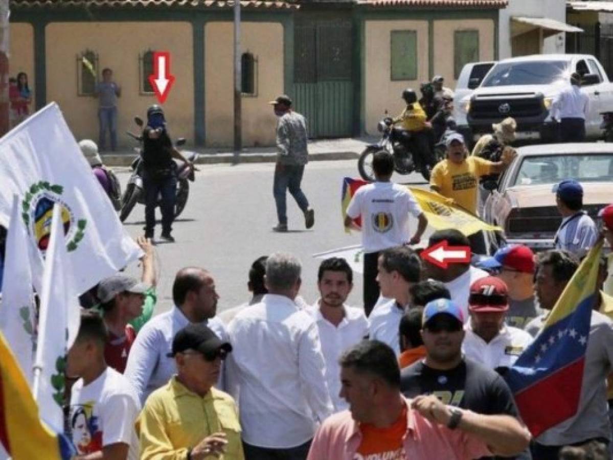 Partidarios de Maduro apuntan sus armas contra Guaidó durante marcha