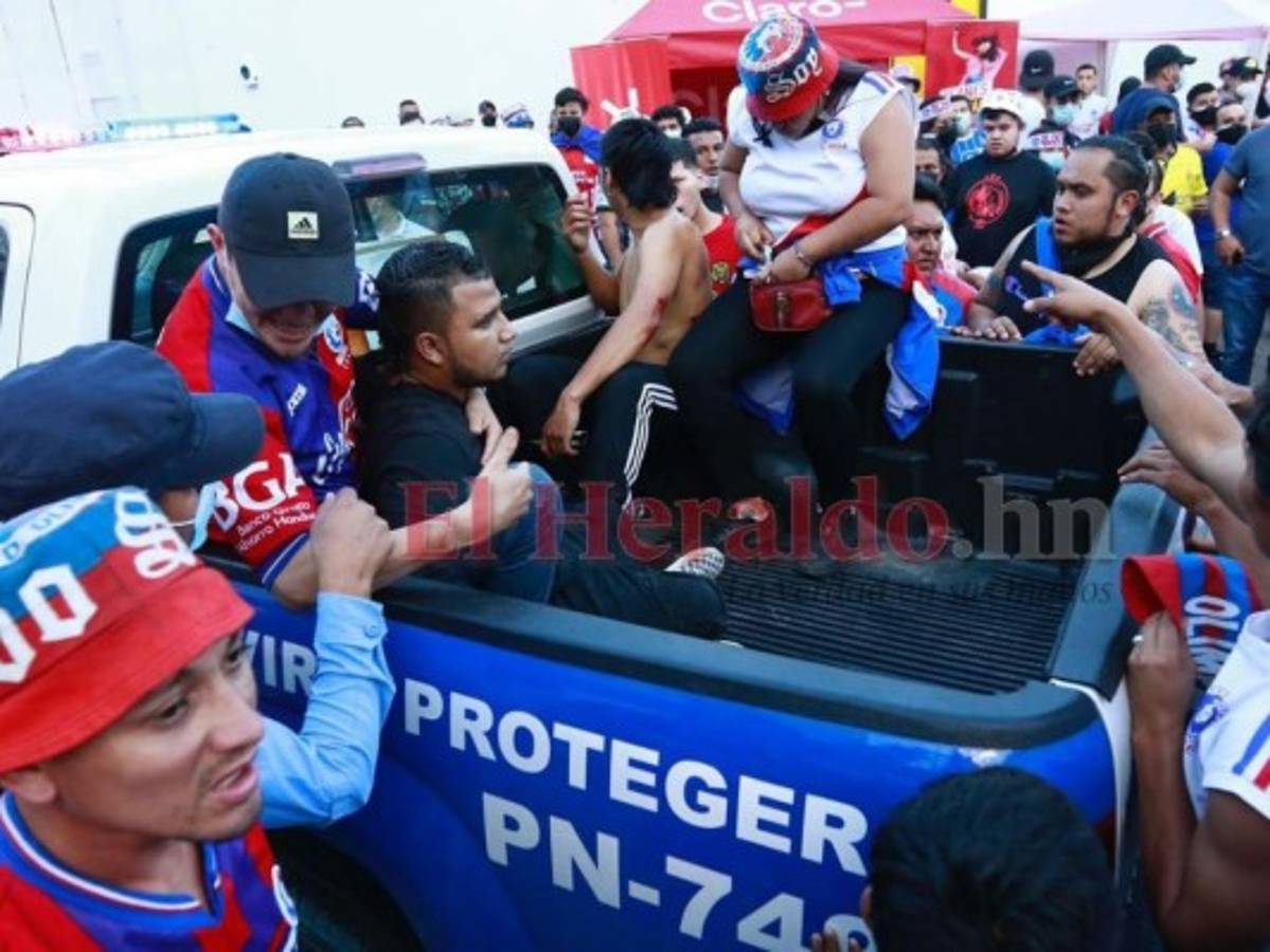 Al menos 12 personas heridas dejan disturbios entre barras de Olimpia y Real España