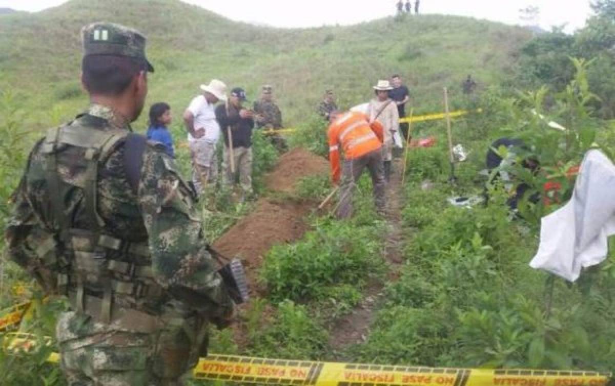 Hallan en Colombia dos fosas comunes con restos de 14 personas