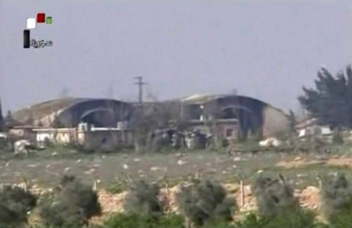 This frame grab from video provided by the Syrian official TV, a Syrian government channel that is consistent with independent AP reporting, shows the burned and damaged hangar warplanes which attacked by U.S. Tomahawk missiles, at the Shayrat Syrian government forces airbase, southeast of Homs, Syria, Friday April, 7, 2017. (Syrian government TV, via AP)