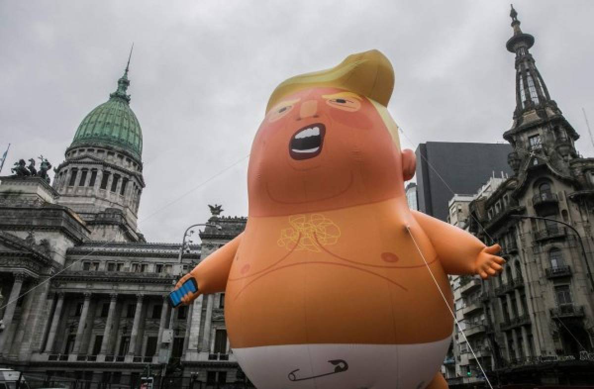 View of a balloon depicting US President Donald Trump outside the Congress building in Buenos Aires on November 29, 2018, as part of the People's Summit. - Global leaders gather in the Argentine capital for a two-day G20 summit beginning on Friday likely to be dominated by simmering international tensions over trade. (Photo by Alberto RAGGIO / AFP)