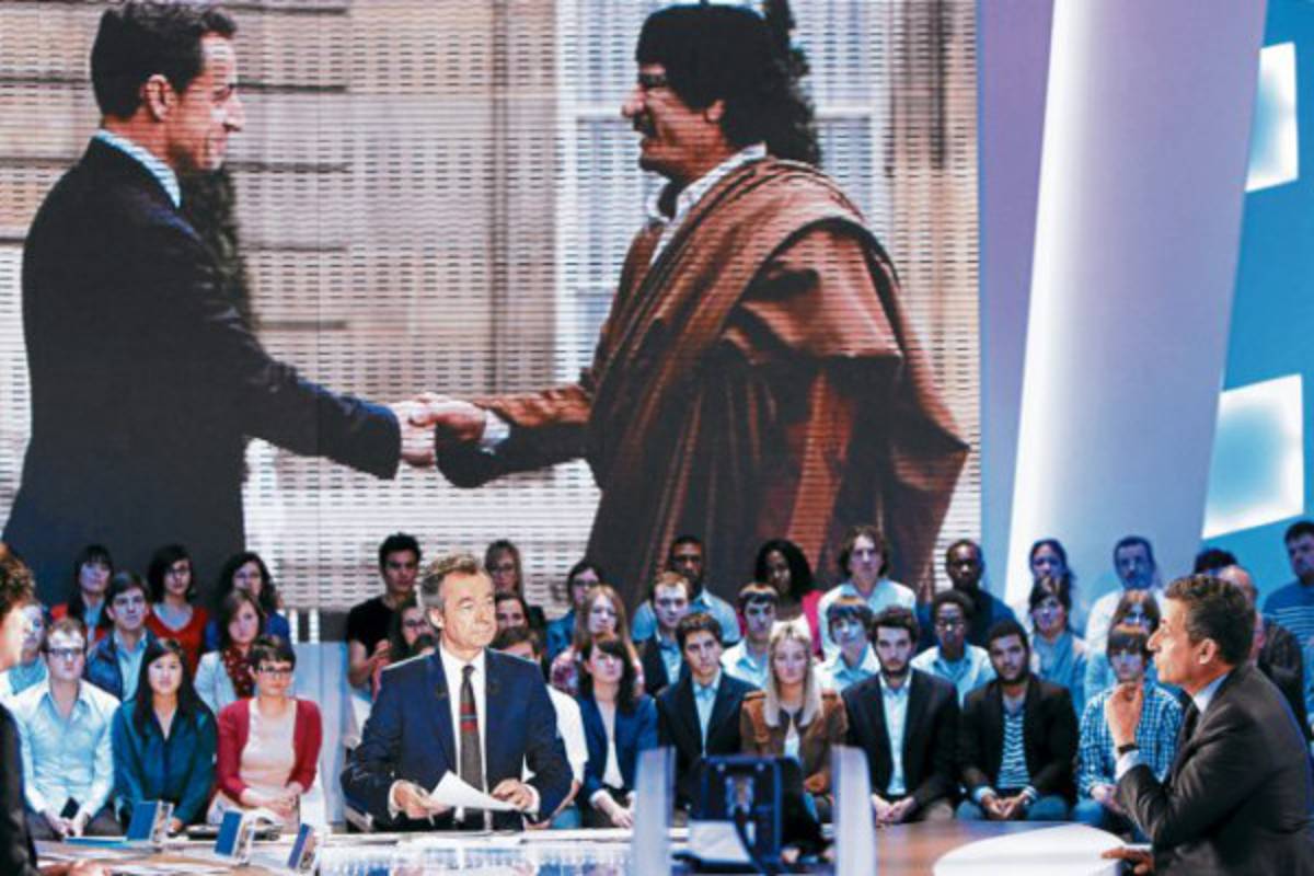 Sarkozy critica 'infamia' de ex dirigente libio sobre campaña de 2007