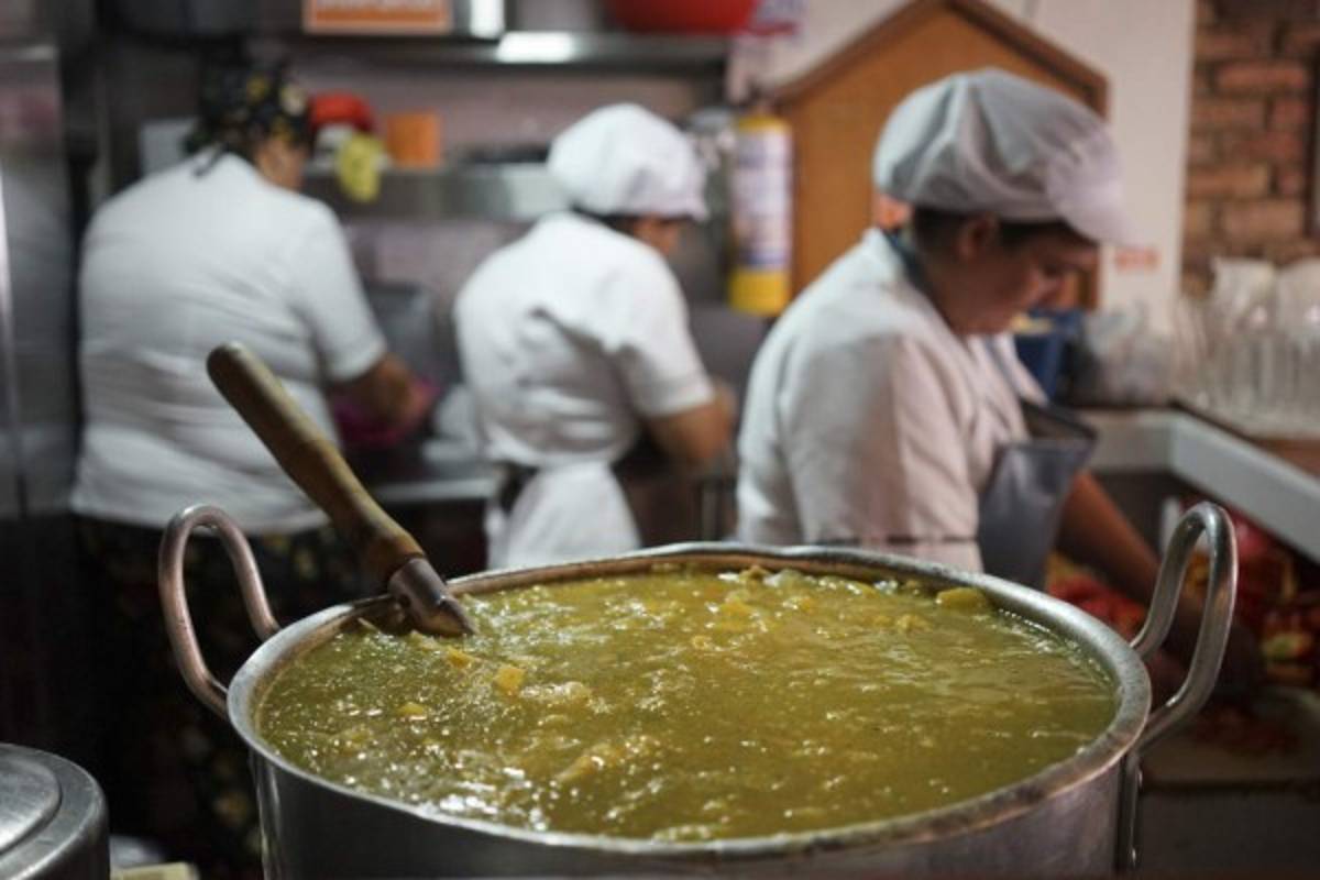 This Aug. 29, 2017 photo shows a stock pot filled with the simmering traditional Colombian soup called ajiaco, at Felinos Restaurant in Bogota, Colombia. The thick soup prepared with potatoes, chicken, corn and an herb known as guascas has been keeping Bogotanos in the nation’s chilly capital warm since at least the 1800s. (AP Photo/Christine Armario)