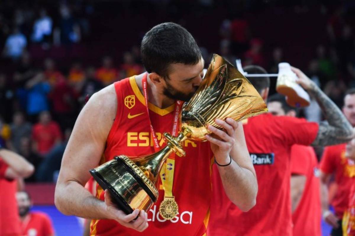 Spain's Marc Gasol celebrates with their winning trophy at the end of the Basketball World Cup final game between Argentina and Spain in Beijing on September 15, 2019. (Photo by Greg BAKER / AFP)