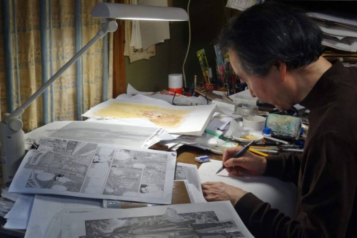 (FILES) This file picture taken on March 5, 2012 shows Japanese comic artist Jiro Taniguchi drawing in his studio in Tokyo. Jiro Taniguchi, a legend in Japan's comic art of manga, died in Tokyo on February 11, 2017 at the age of 69, leaving behind an international following for his exquisite line drawing of scenes from everyday life. / AFP PHOTO / Karyn NISHIMURA-POUPEE