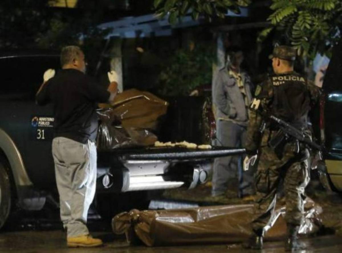 Indagan extorsiones como móvil de masacre en autolote de San Pedro Sula