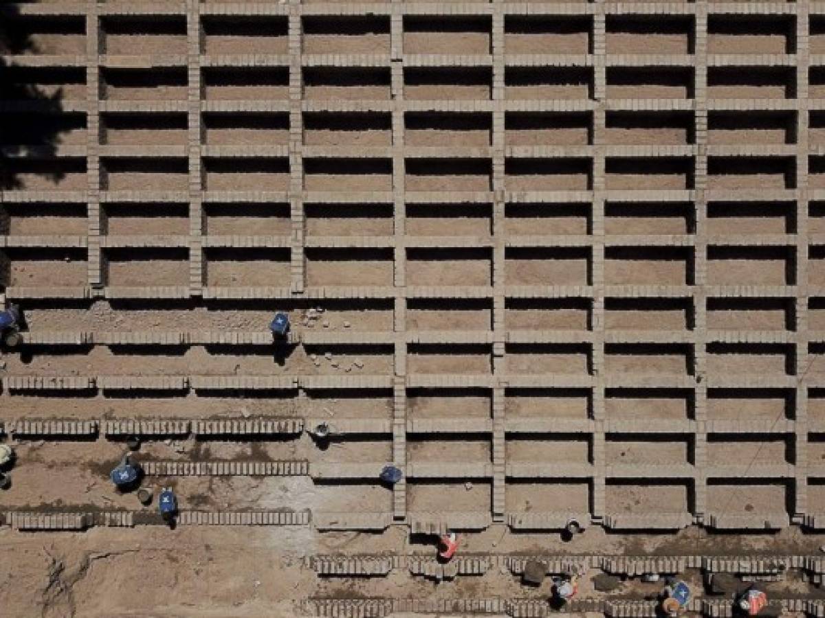 TOPSHOT - Workers build 700 graves at the Mezquitán Pantheon cemetery in preparation for possible victims of the novel COVID-19 coronavirus in Guadalajara, Mexico on April 24, 2020. (Photo by ULISES RUIZ / AFP)