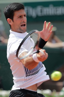 Rafael Nadal y Novak Djokovic avanzan, Olivo sorprende a Tsonga en el Abierto de Francia