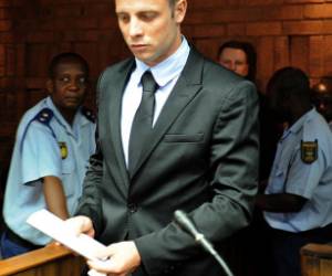 South African Olympic sprinter Oscar Pistorius appears on February 20, 2013 at the Magistrate Court in Pretoria. Pistorius battled to secure bail as he appeared on charges of murdering his model girlfriend Reeva Steenkamp on February 14, Valentine's Day. South African prosecutors will argue that Pistorius is guilty of premeditated murder in Steenkamp's death, a charge which could carry a life sentence. AFP PHOTO / STEPHANE DE SAKUTIN